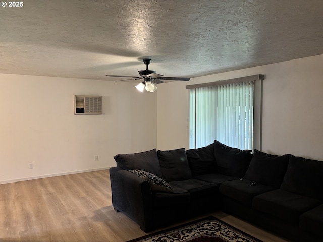 145 Donald Ter, Myrtle Creek, OR 97457 - living room with light wood-type flooring, a ceiling fan, a textured ceiling, and baseboards
