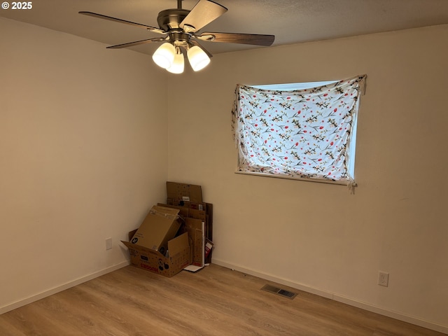 145 Donald Ter, Myrtle Creek, OR 97457 - unfurnished room featuring wood finished floors, ceiling fan, and baseboards