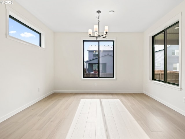 17019 NE 82nd St, Vancouver, WA 98682 - unfurnished room featuring baseboards, a notable chandelier, and light wood-style floors