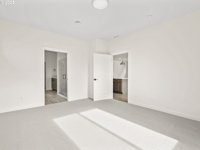 17019 NE 82nd St, Vancouver, WA 98682 - unfurnished bedroom featuring light carpet, ensuite bath, and baseboards