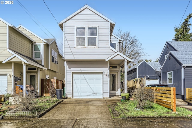 traditional-style house featuring concrete driveway, fence, and a garage