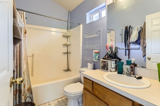 bathroom featuring vanity, toilet, and shower / tub combo with curtain