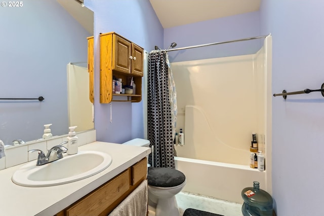 full bath with vanity, shower / tub combo, and toilet