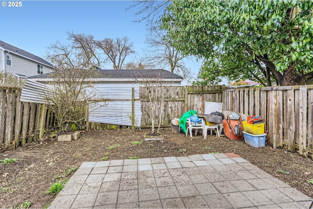 view of yard with a fenced backyard and a patio