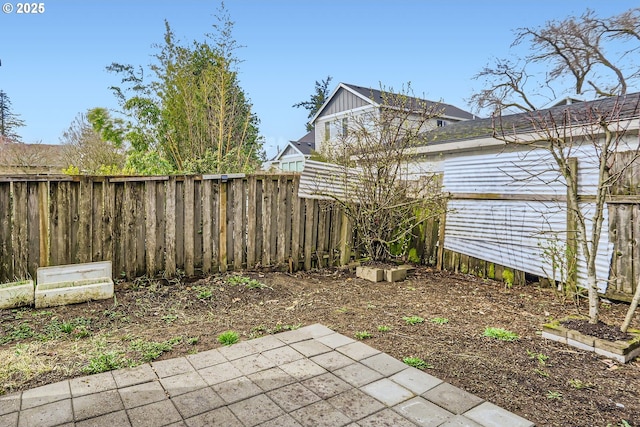 view of yard with a patio and a fenced backyard