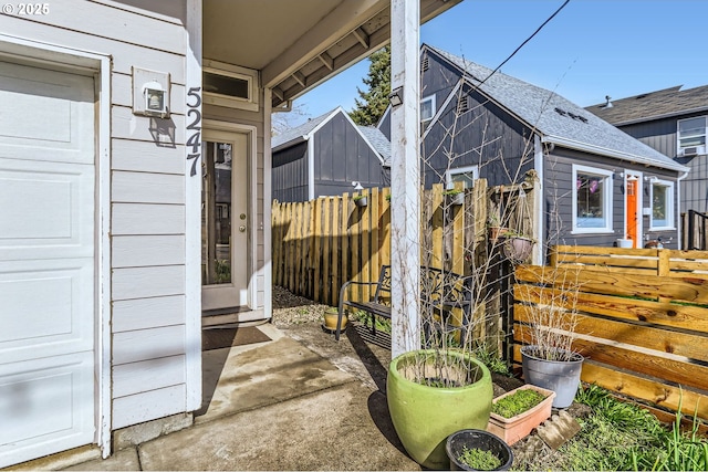 view of side of property featuring fence