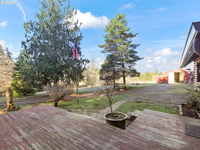 wooden deck featuring an outbuilding