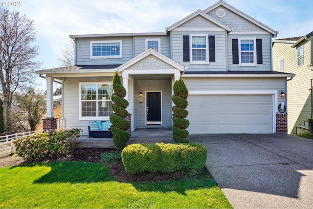 view of front of property with concrete driveway, a garage, and fence