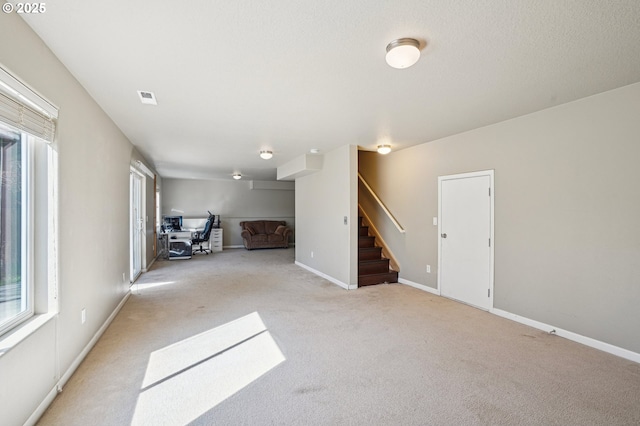 carpeted bedroom featuring baseboards and ceiling fan