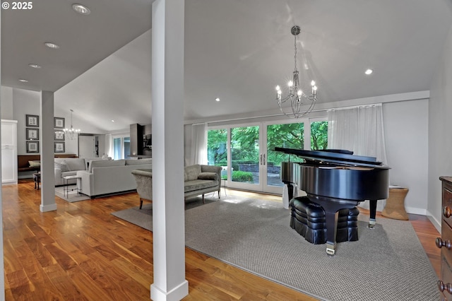 7100 SW Willowmere Dr, Portland, OR 97225 - living room with a chandelier, lofted ceiling, wood finished floors, and recessed lighting