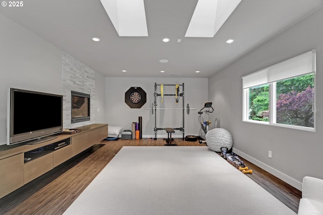 7100 SW Willowmere Dr, Portland, OR 97225 - workout area with baseboards, dark wood-style floors, recessed lighting, and a skylight