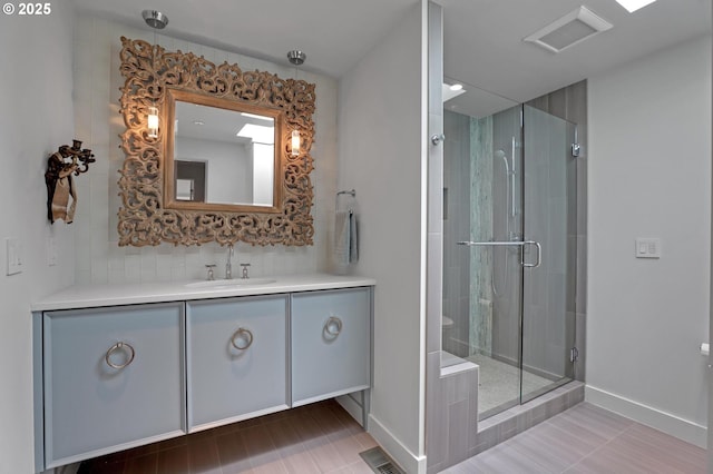 7100 SW Willowmere Dr, Portland, OR 97225 - bathroom with vanity, a shower stall, and baseboards