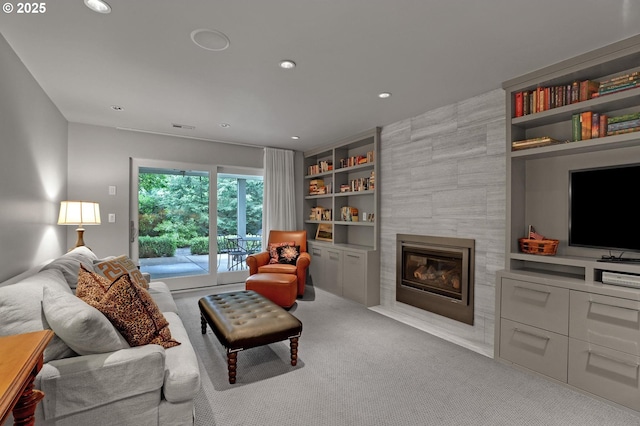 7100 SW Willowmere Dr, Portland, OR 97225 - living room featuring built in features, carpet flooring, a fireplace, and recessed lighting