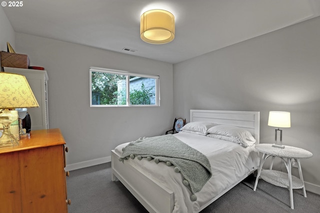 7100 SW Willowmere Dr, Portland, OR 97225 - bedroom with dark colored carpet and baseboards