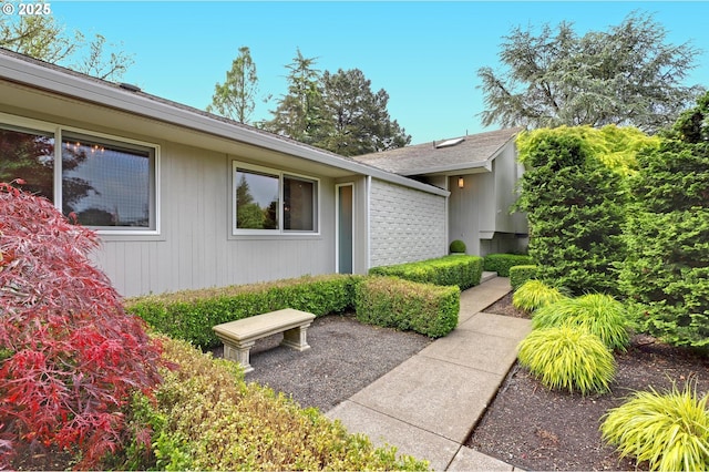 7100 SW Willowmere Dr, Portland, OR 97225 - view of side of property with brick siding