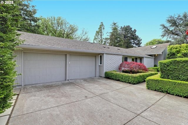 7100 SW Willowmere Dr, Portland, OR 97225 - single story home with a garage and concrete driveway