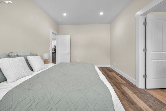 bedroom featuring hardwood / wood-style flooring