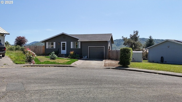 715 Penny Ln, Riddle, OR 97469 - ranch-style home with an attached garage and driveway