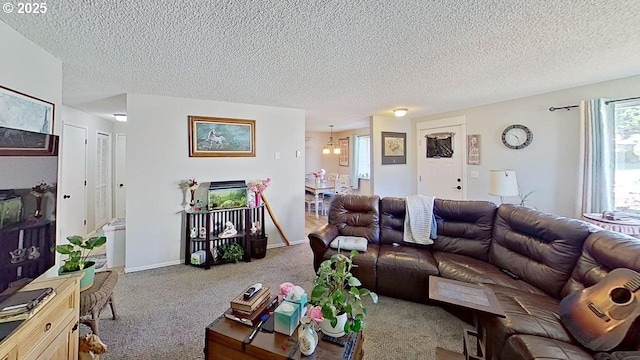 715 Penny Ln, Riddle, OR 97469 - carpeted living area with a textured ceiling and a chandelier