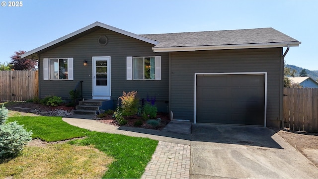 715 Penny Ln, Riddle, OR 97469 - view of front of home featuring driveway, a garage, and a shingled roof