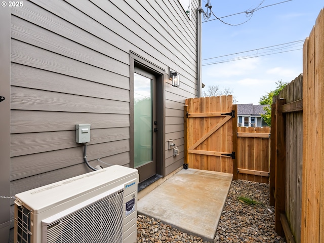 7040 N Leonard Ave, Portland, OR 97203 - view of patio / terrace with a cooling unit and a gate