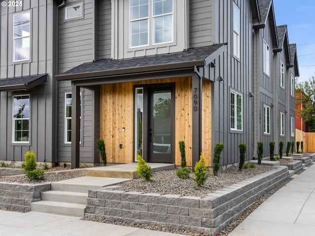 7040 N Leonard Ave, Portland, OR 97203 - view of exterior entry with board and batten siding and roof with shingles