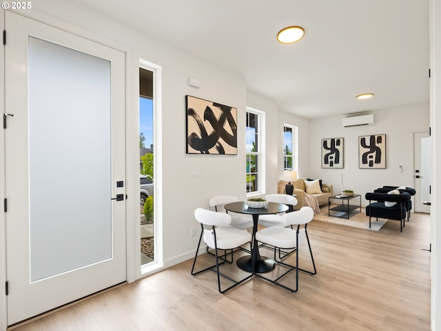 7040 N Leonard Ave, Portland, OR 97203 - dining area with a wall unit AC, light wood-style flooring, baseboards, and recessed lighting