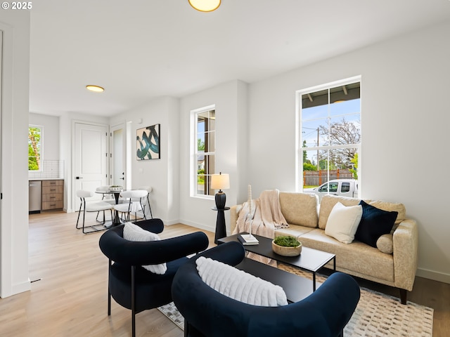 7040 N Leonard Ave, Portland, OR 97203 - living room featuring plenty of natural light, light wood-type flooring, and baseboards