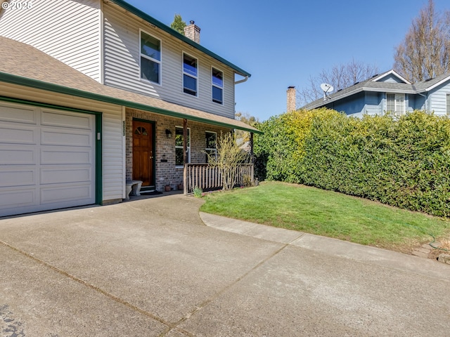 view of front of house with brick siding, a chimney, covered porch, an attached garage, and a front yard