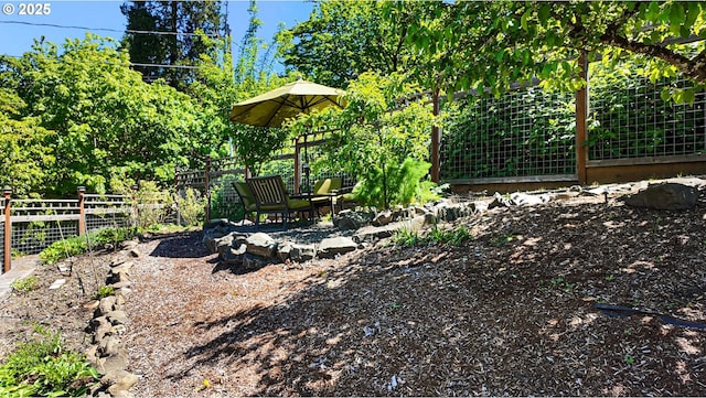 view of yard with fence