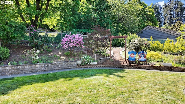 view of yard with view of wooded area