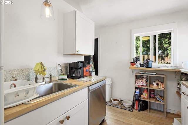 1510 W 10th St, The Dalles, OR 97058 - kitchen with dishwasher, light wood-type flooring, white cabinetry, and decorative light fixtures