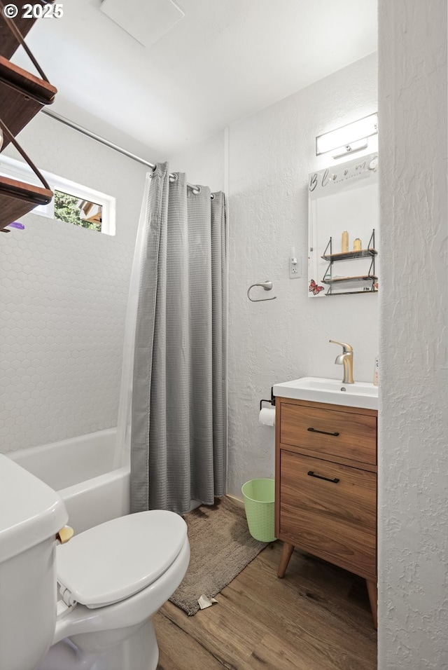1510 W 10th St, The Dalles, OR 97058 - bathroom with wood finished floors, vanity, a textured wall, and shower / bath combination with curtain