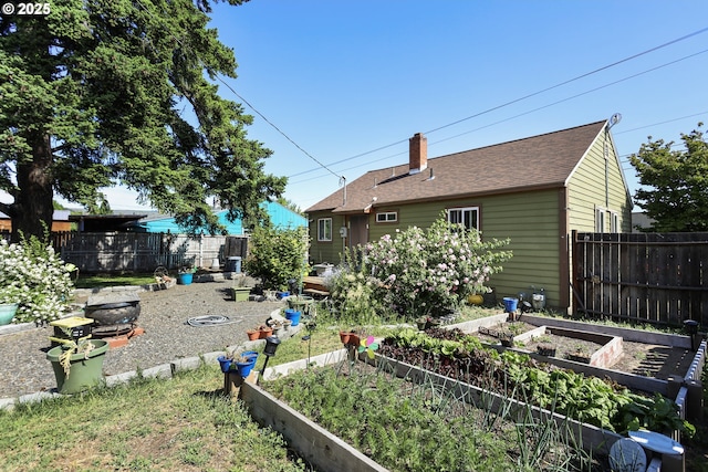 1510 W 10th St, The Dalles, OR 97058 - view of yard featuring a garden and an outdoor fire pit