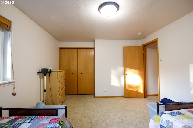 carpeted bedroom featuring a closet