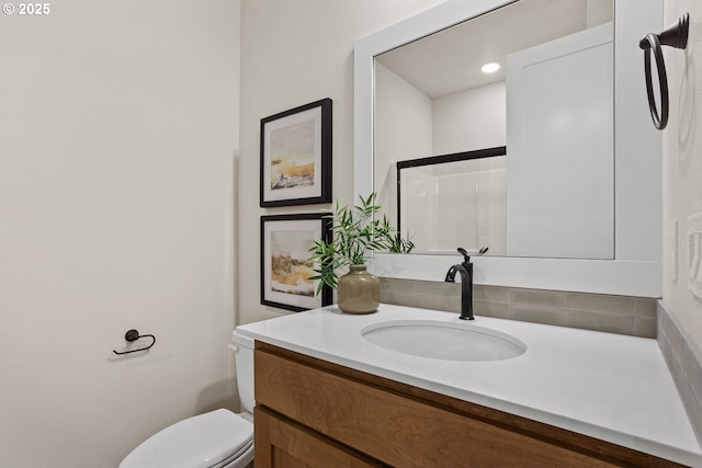 bathroom with toilet and vanity