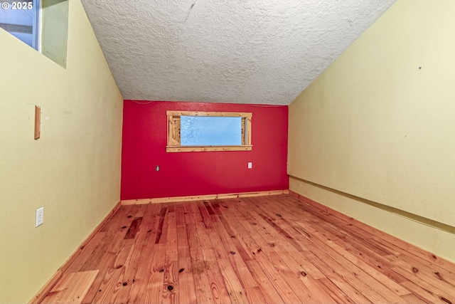 151 Owl Creek Rd, Kelso, WA 98626 - bonus room with a textured ceiling, baseboards, and hardwood / wood-style floors