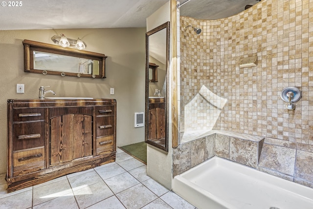 151 Owl Creek Rd, Kelso, WA 98626 - full bathroom featuring heating unit, tiled shower, tile patterned floors, vaulted ceiling, and vanity