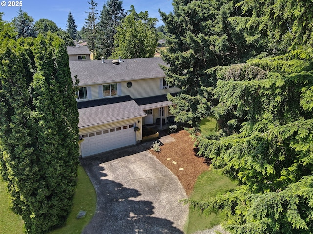 13503 NE 80th Cir, Vancouver, WA 98682 - traditional home with driveway, a shingled roof, a garage, and a chimney