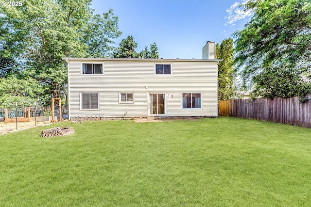 13503 NE 80th Cir, Vancouver, WA 98682 - back of property featuring a chimney, a fire pit, and a fenced backyard