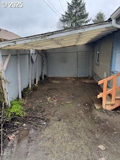 spare room with dark wood-type flooring and baseboards