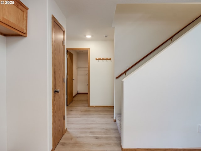 corridor with recessed lighting and light wood finished floors