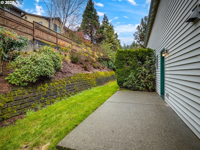 view of yard with fence and a patio area