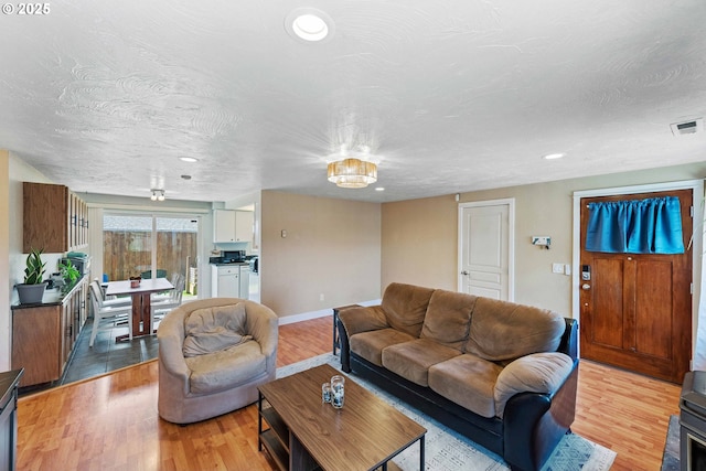 1065 Fenwick St, Coos Bay, OR 97420 - living room with light wood-type flooring, recessed lighting, and baseboards