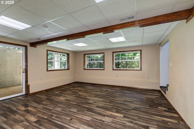 25363 Wonderly Rd, Rainier, OR 97048 - empty room with dark wood-style floors, a drop ceiling, and baseboards