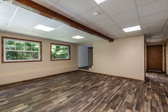 25363 Wonderly Rd, Rainier, OR 97048 - empty room with a paneled ceiling, dark wood finished floors, baseboards, and a smoke detector