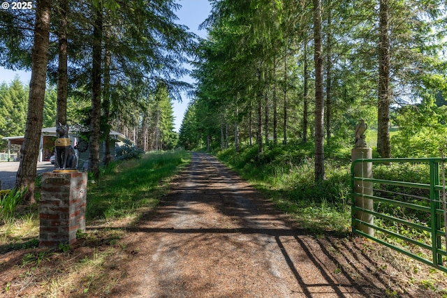 25363 Wonderly Rd, Rainier, OR 97048 - view of dirt / gravel road with a gate and a gated entry