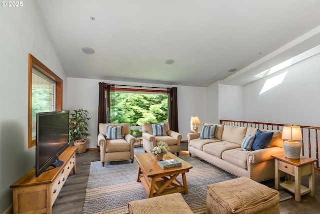 25363 Wonderly Rd, Rainier, OR 97048 - living area with a skylight, vaulted ceiling, dark wood finished floors, plenty of natural light, and baseboards