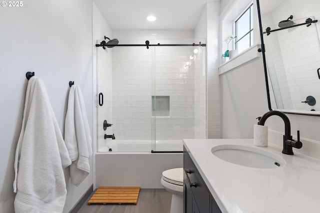 full bath with vanity, toilet, combined bath / shower with glass door, and recessed lighting