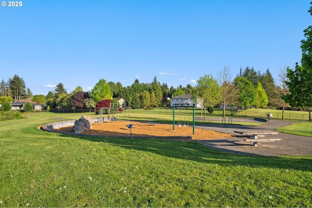 view of home's community with a yard
